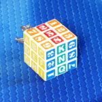 Брелок "Кубик Рубика" с символами, белый